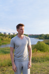 Young handsome man thinking against beautiful relaxing view of nature