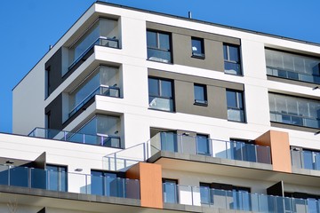 Modern apartment buildings on a sunny day with a blue sky. Facade of a modern apartment building