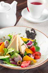 Greek salad with fresh vegetables, feta cheese close up