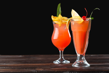Alcoholic and non alcoholic cocktails on wooden table. Summer cold drinks