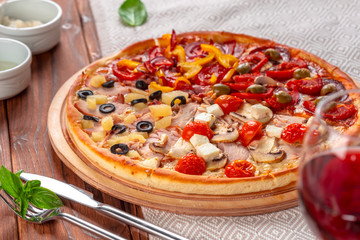 Delicious fresh pizza served on wooden table