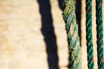 old and new rope in closeup style on blur wood background 