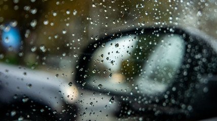 rainy weather, autumn time. drops on the vehicle's windows and blurry effect. rainy season and cold and cool weather. drops of rain on glass.