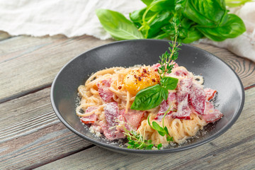 Pasta Carbonara. Spaghetti with bacon, parsel and parmesan cheese