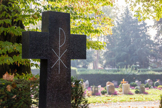 Cross with Chi Rho Symbol, that is one of the earliest forms of christogramts and hat stands for peace in Christianity. Religious concept for a cemetery