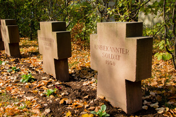 War memorial cemetery of the fallen German soldiers during the world war two (1938-1945) with a cross of a buried unknown soldier (German: Unbekannter Soldat)