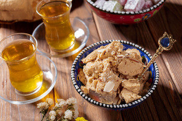 Tasty halva with tea on the table