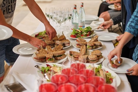 snacks, sandwiches, drinks at the buffet. guests help themselves