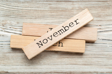 top view of parts of wooden calendar on dark wooden tabletop