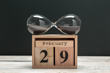 February 29th. Day 29 of february month, calendar on wooden background. Winter time