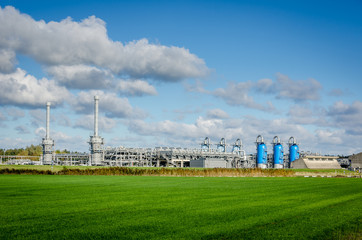 Natural gas processing site. Modern equipment is used to mine the last remainder from the field. Location of the NAM near the dutch town Norg. - obrazy, fototapety, plakaty