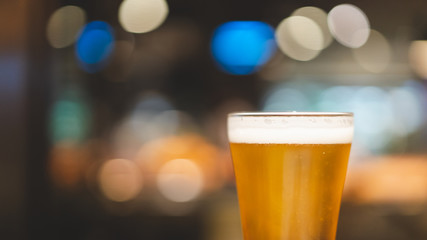 chill beer on dark background and light bokeh