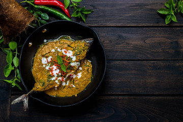 Fried fish with curry paste NO.002. Intense flavor Delicious fried fish with crispy topped with spicy red curry.