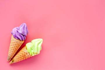 Two of ice cream cone on pink background for sweet and refreshing dessert concept