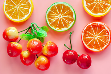 Simulation fake and artificial fruit on pink background for decorations