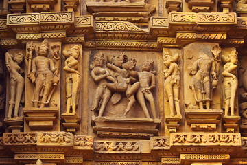 Sex Poses - Close up of Kamasutra scenes on the wall of Hindu temple in western group of temple Khajuraho, India