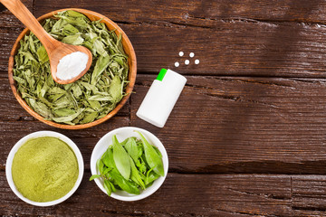 Pills, powder and leaves of stevia plant - Stevia rebaudiana. Sweetener