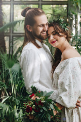 Naklejka premium Beautiful couple in botanical garden