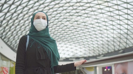 portrait of a muslim girl in medical dressing in mall