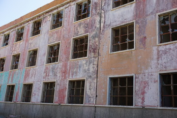 Fototapeta na wymiar Abandoned house with boarded up windows and doors