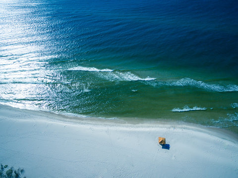 Drone/Aerial Photograph of the Gulf of Mexico washing ashore on the beautiful white sand beach of Gulf Shores/Fort Morgan, Alabama.  USA