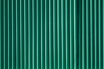 abstract green metal facade with shadowplay
