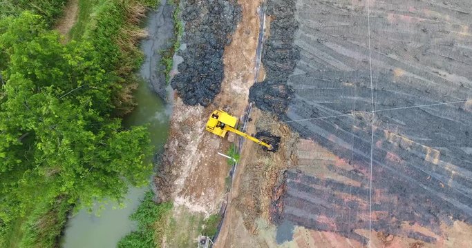 Drone view excavator working on industrial 