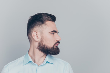 Obraz premium Close up half turned studio photo portrait of handsome focused w