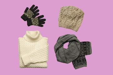 Set of sylish winter clothes on colour background with hat, mittens, sweater, scarf. flat lay, top view