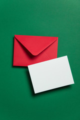 Blank white card with red paper envelope Christmas card template mock up.