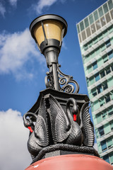 Dettail of a city lightbulb with a black swan