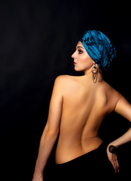 Beautiful Woman In Turban From The Back