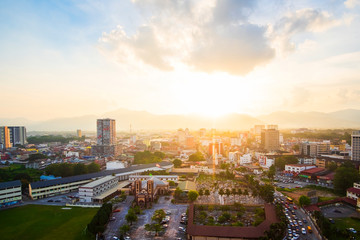 Naklejka na ściany i meble Aerial Image of Ipoh Town,Malaysia during sunset.Soft Focus,Blur due to Long Exposure.