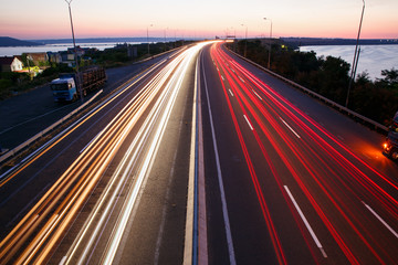 light trails on a highway road from above 