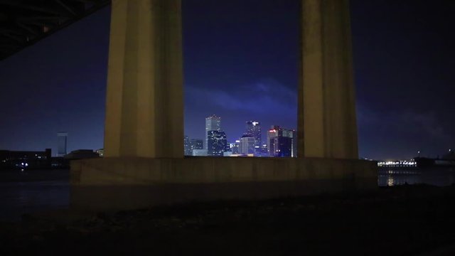 View of New Orleans skyline through I-10 pillars