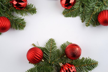 Merry Christmas. Christmas ornaments creatively arranged across the frame. Seasons greetings. Flat lay or top view.