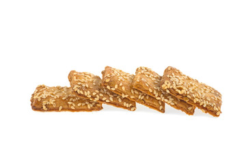 Cookies with sesame seeds isolated on a white background. Sweet cookies. Homemade dough.