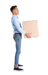 Full length portrait of young man carrying heavy cardboard box on white background. Posture concept
