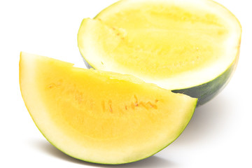 Sliced watermelon with yellow flesh on a white background