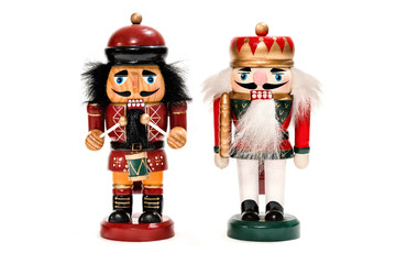 Merry Christmas: Two traditional colorful vintage wooden nutcracker puppets in uniform isolated on...