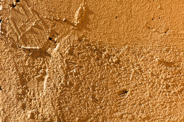 Old wall painted with yellow paint as a background