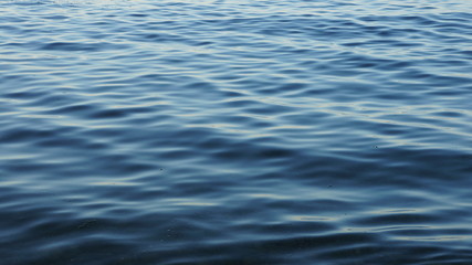 Naklejka premium Gentle Waves on the Water Surface Background