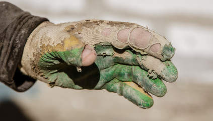 The glove on the hand of the builder