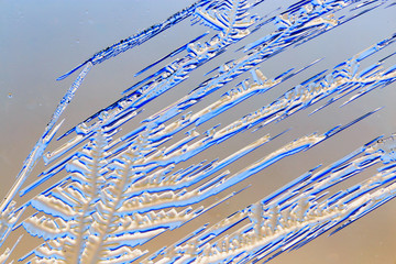 Fototapeta premium Snow patterns on glass as an abstract background