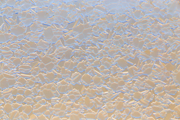 Snow patterns on glass as an abstract background