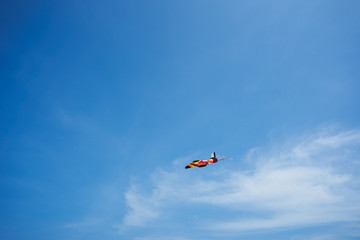 Fototapeta na wymiar Airplane kite in the air on blue sky background