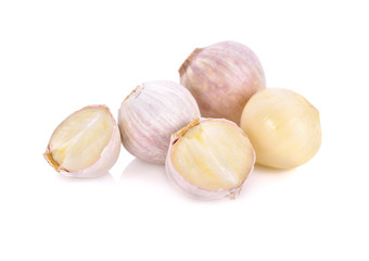 whole and cut garlic bulb on white background