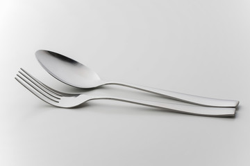 cutlery fork and spoon over white background