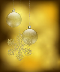 Christmas design with golden glitter snowflake ornament and two baubles and space for text on golden bokeh background.