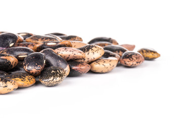 Lot of whole speckled colored butter beans painted lady scarlet runner variety isolated on white background